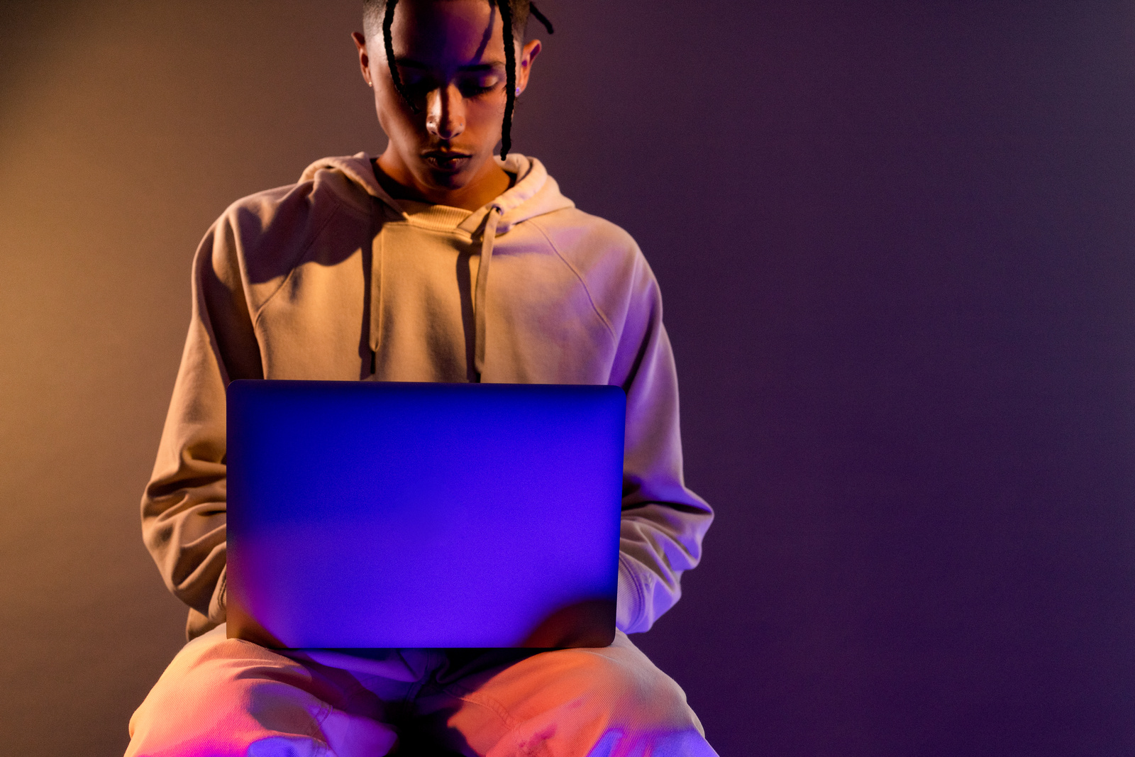 Tech Glow Man Using a Laptop